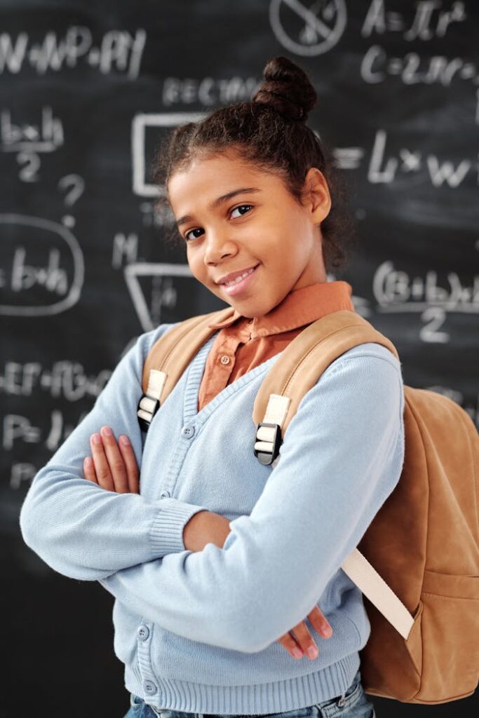 Girl in Blue Long Sleeve Shirt and Brown Leather Backpack